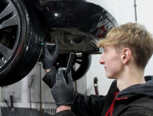 Mechanic carrying out MOT Preparation Guide